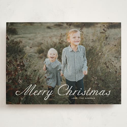 This is a powder holiday photo cards with standard by Carolyn MacLaren called outlined script printing on signature in grand