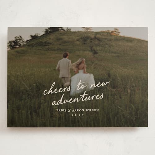 This is a creme holiday photo cards with standard by Owl and Toad called adventure printing on signature in grand
