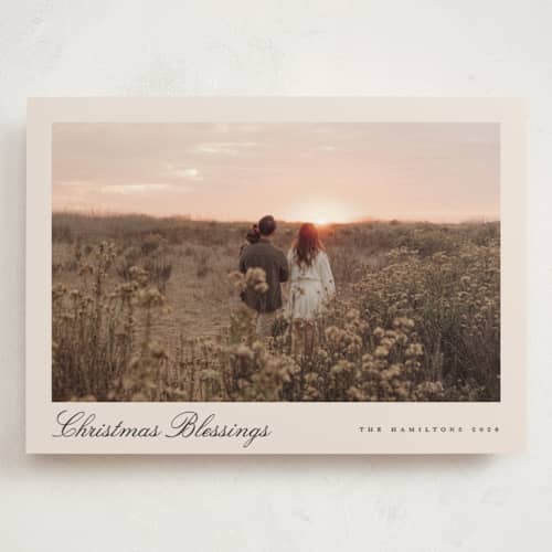 This is a tan holiday photo cards with standard by Nicole Walsh called pano script printing on signature in grand