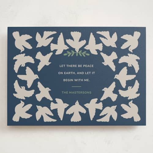 This is a navy holiday photo cards with standard by Tanamachi Studio called let there be peace printing on signature in grand