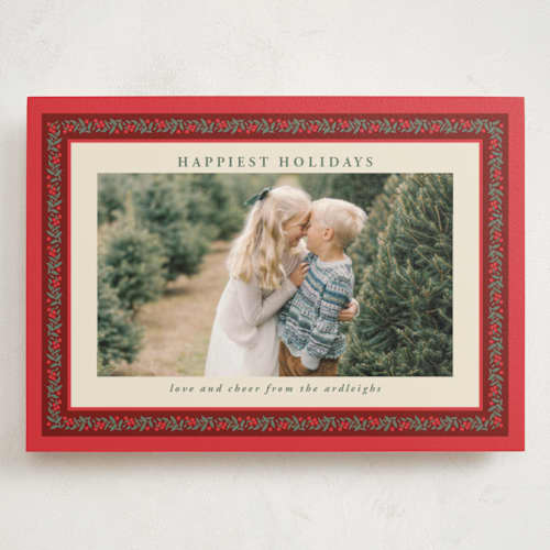 This is a holly berry holiday photo cards with standard by Kristie Kern called revelry printing on signature in grand