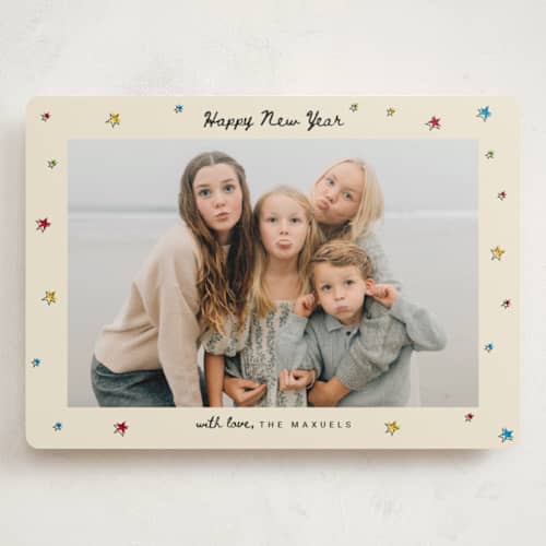 This is a champagne holiday photo cards with standard by Ilene Guy called bright star printing on signature in grand