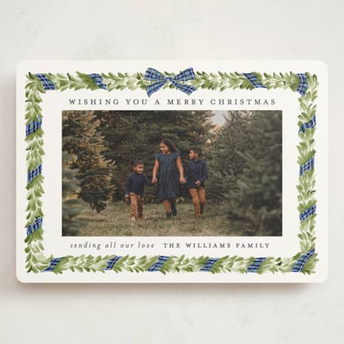 This is a navy holiday photo cards with standard by Sarah Knight called plaid ribbon printing on signature in grand