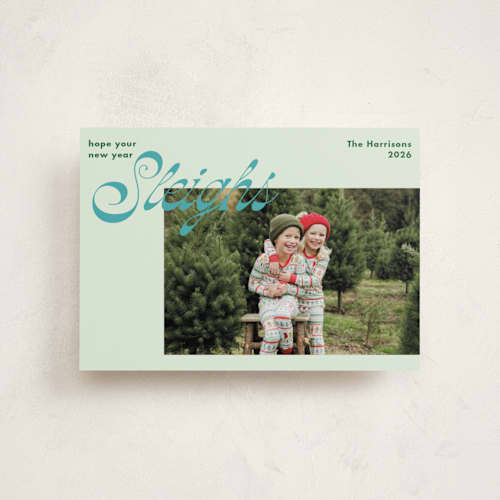 This is a turquoise petite holiday cards with standard by Megan Davis called sleighs printing on recycled smooth signature in petite