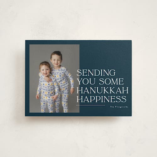 This is a navy hanukkah cards with standard by Jackie Crawford called sending holiday happiness printing on signature in postcard