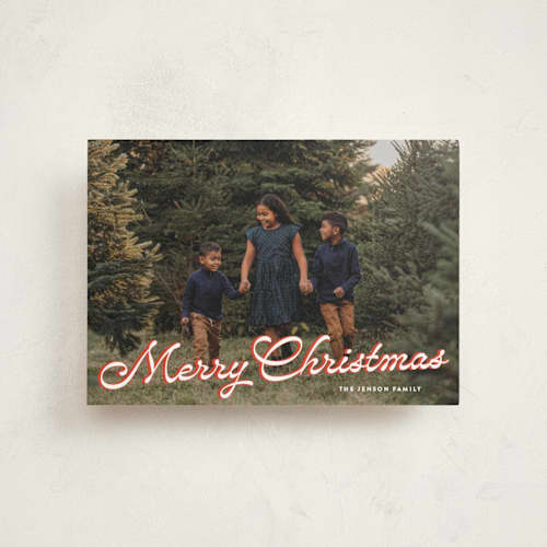 This is a poinsettia petite holiday cards with standard by Ekko Studio called retro script printing on signature in petite