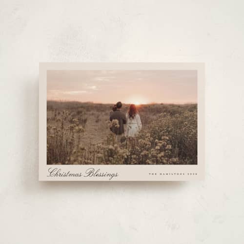 This is a tan petite holiday cards with standard by Nicole Walsh called pano script printing on signature in petite