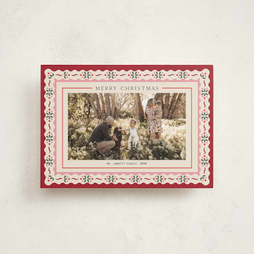 This is a poinsettia christmas postcards with standard by Laura Bercovich called poinsettia in bloom printing on signature in postcard