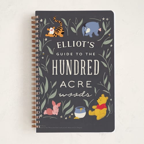 This is a midnight journals with standard by JeAnna Casper called the hundred acre woods from disney's winnie the pooh printing on premium cover stock in notebook