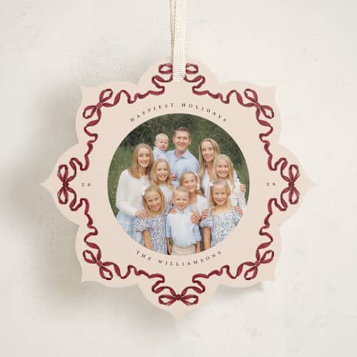 This is a cranberry holiday card ornaments with standard by Jenna Holcomb called bow ornament printing on recycled smooth signature in ornament