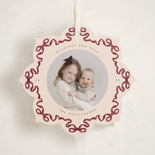 This is a cranberry holiday card ornaments with standard by Jenna Holcomb called bow ornament printing on recycled smooth signature in ornament