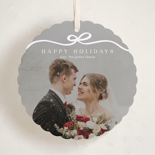 This is a snow holiday card ornaments with standard by Kaydi Bishop called bow tied printing on recycled smooth signature in ornament