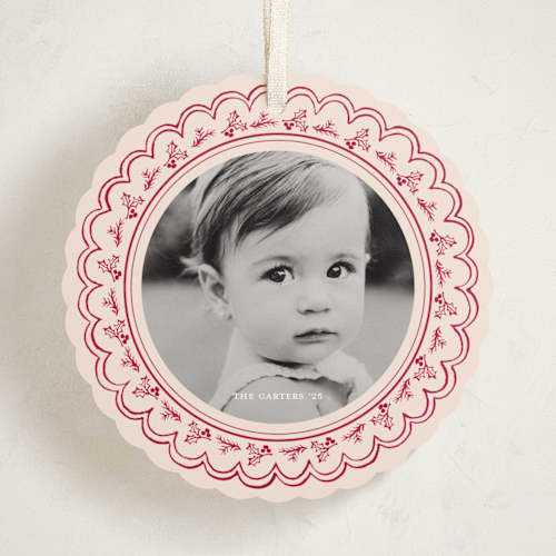 This is a cranberry holiday card ornaments with standard by Teju Reval called scalloped holly printing on recycled smooth signature in ornament