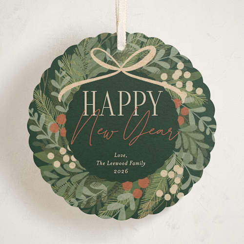 This is a pine needle holiday card ornaments with standard by Erin German called botanical wreath printing on signature in ornament
