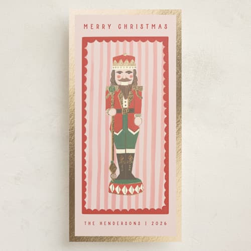 This is a rose foil pressed holiday cards with foil pressed by Teju Reval called gilded nutcracker printing on signature in tall