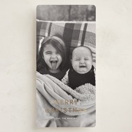 This is a snow foil pressed holiday cards with foil pressed by Ani Somi called just bold type printing on recycled smooth signature in tall