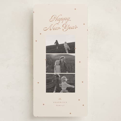 This is a salmon holiday photo cards with standard by Ellen Schlegelmilch called dainty dots printing on recycled smooth signature in tall