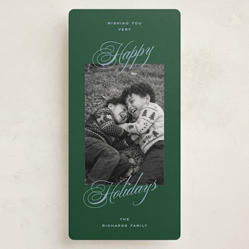 This is a spruce holiday photo cards with standard by Amy Kross called manor printing on recycled smooth signature in tall
