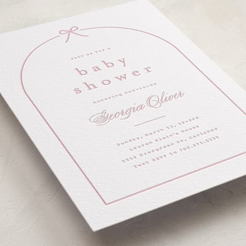 This is a peony baby shower invitations with letterpress by Carolyn MacLaren called arching bow printing on white cotton in standard