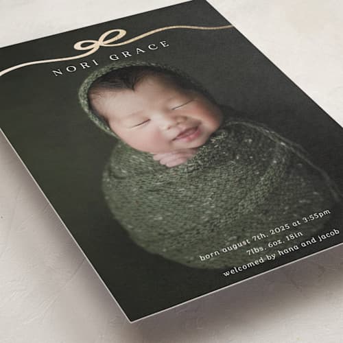 This is a cotton foil stamped birth announcements with foil pressed by Kaydi Bishop called bow tied printing on recycled smooth signature in standard