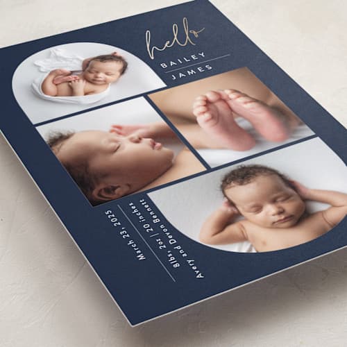 This is a navy foil stamped birth announcements with foil pressed by Carolyn MacLaren called so current printing on recycled smooth signature in standard