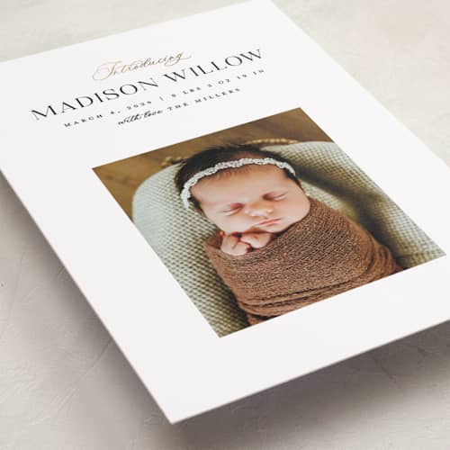 This is a sugar foil stamped birth announcements with foil pressed by Pixel and Hank called now introducing printing on recycled smooth signature in standard