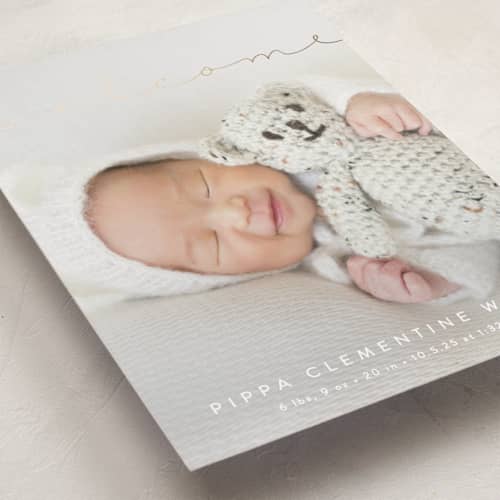 This is a cloud foil stamped birth announcements with foil pressed by Olivia Raufman called delicate welcome printing on recycled smooth signature in standard