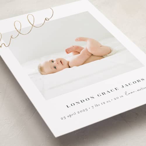 This is a warm grey foil stamped birth announcements with foil pressed by Shirley Lin Schneider called angled hello printing on recycled smooth signature in standard