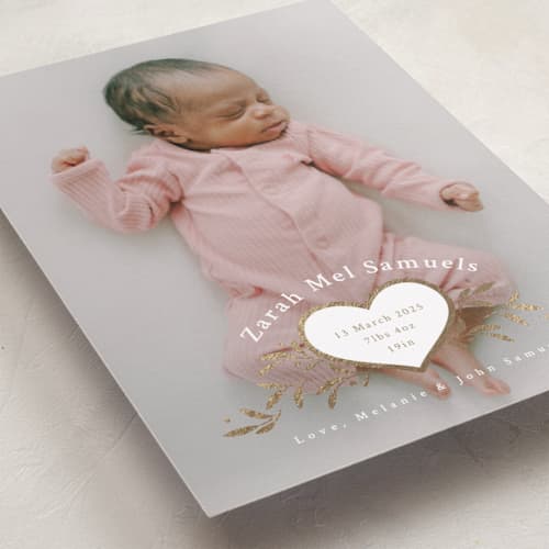 This is a snow foil stamped birth announcements with foil pressed by letterfix called heart crest printing on recycled smooth signature in standard
