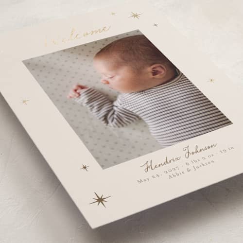 This is a linen foil stamped birth announcements with foil pressed by Nicole Walsh called scattered stars printing on recycled smooth signature in standard