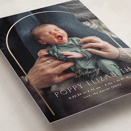 This is a linen foil stamped birth announcements with foil pressed by Erica Krystek called classic arch printing on recycled smooth signature in standard