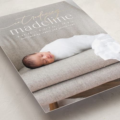 This is a parchment foil stamped birth announcements with foil pressed by Everett Paper Goods called mist printing on recycled smooth signature in standard