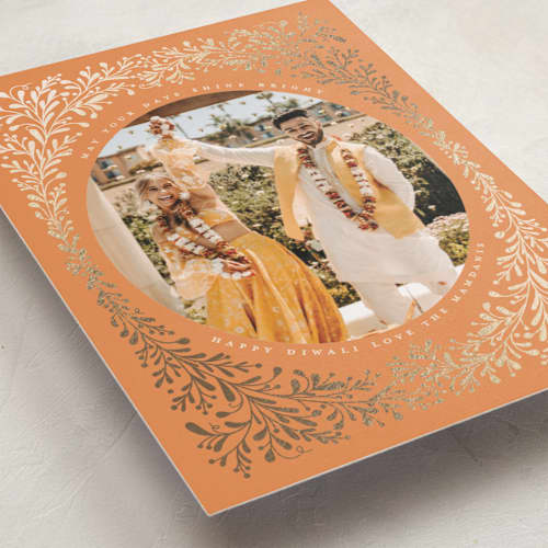 This is a tangerine diwali cards with foil pressed by Kamala Nahas called diwali botanical printing on recycled smooth signature in standard