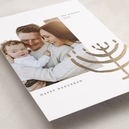 This is a gilded hanukkah cards with foil pressed by Sumak Studio called golden menorah printing on recycled smooth signature in standard