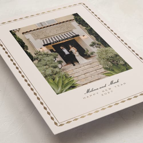 This is a eggnog foil pressed holiday cards with foil pressed by Tamara Hilje called diamond border printing on recycled smooth signature in standard