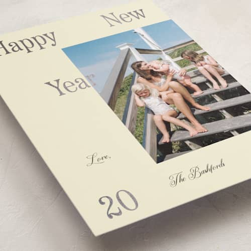 This is a champagne foil pressed holiday cards with foil pressed by Rachel Cassel called it's spaced printing on recycled smooth signature in standard