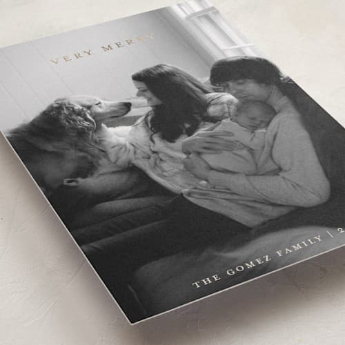 This is a buttercream foil pressed holiday cards with foil pressed by Carolyn Hunt called golden merry printing on recycled smooth signature in standard