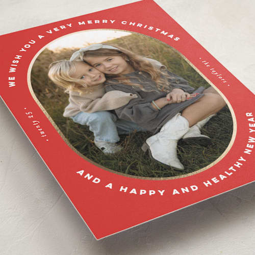 This is a poinsettia foil pressed holiday cards with foil pressed by Erica Krystek called oval frame printing on recycled smooth signature in standard