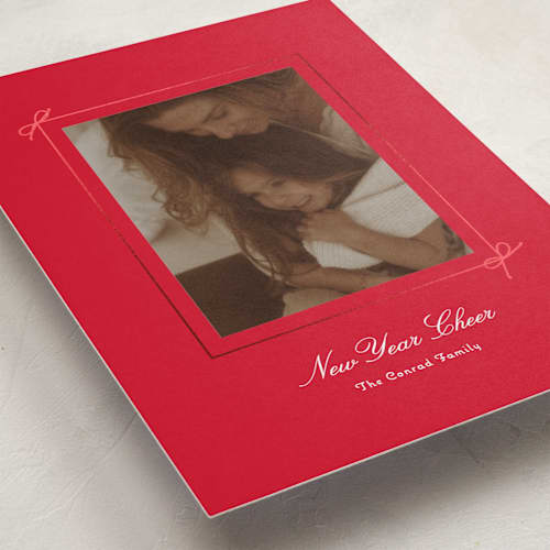 This is a poinsettia foil pressed holiday cards with foil pressed by Baumbirdy called delicate bow printing on recycled smooth signature in standard