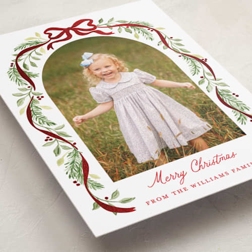 This is a cardinal foil pressed holiday cards with foil pressed by Sarah Knight called ribbon arch printing on recycled smooth signature in standard