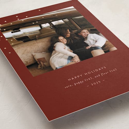 This is a cranberry foil pressed holiday cards with foil pressed by Bramble Studio called starry eyed printing on recycled smooth signature in standard
