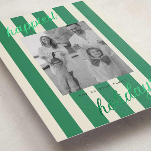 This is a pine foil pressed holiday cards with foil pressed by Louise Kay called happiest holidays printing on recycled smooth signature in standard