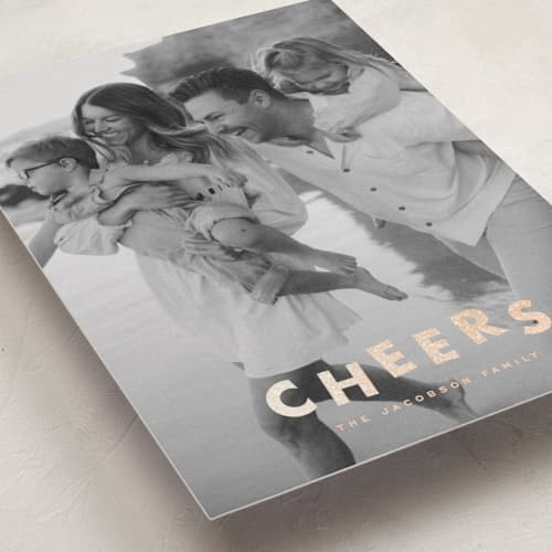 This is a champagne foil pressed holiday cards with foil pressed by Ellen Schlegelmilch called glitter cheers printing on recycled smooth signature in standard