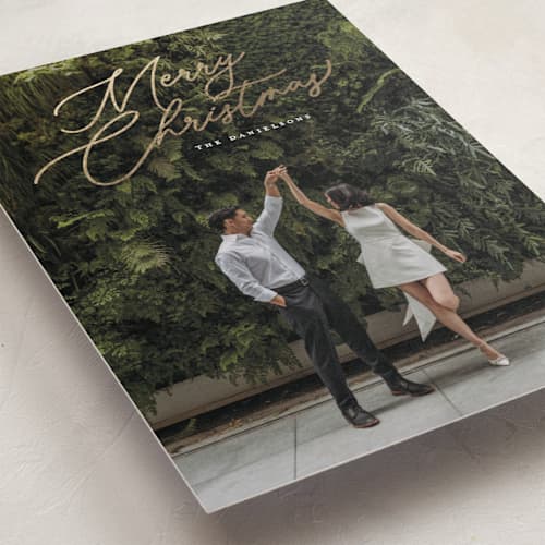 This is a snowfall foil pressed holiday cards with foil pressed by Melanie Kosuge called merry monoline printing on recycled smooth signature in standard