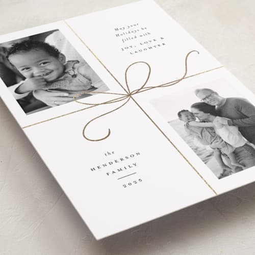 This is a snow foil pressed holiday cards with foil pressed by Emily Betts called bow two printing on recycled smooth signature in standard