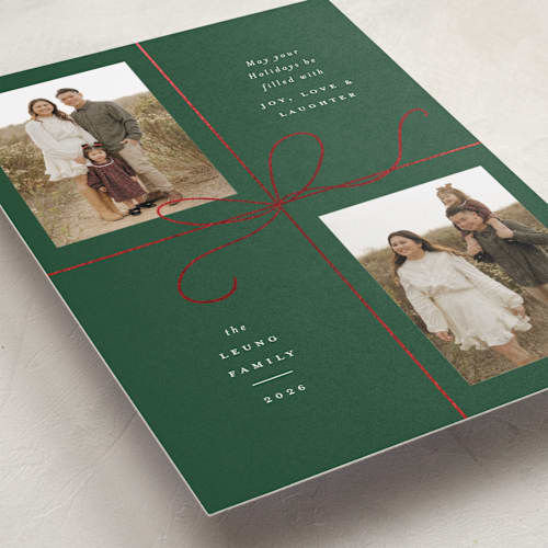 This is a holly foil pressed holiday cards with foil pressed by Emily Betts called bow two printing on recycled smooth signature in standard