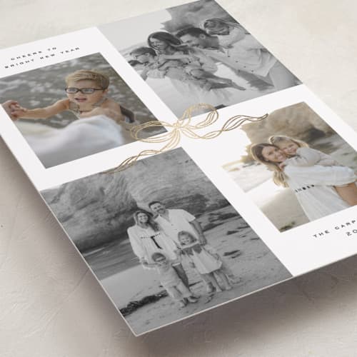 This is a vanilla foil pressed holiday cards with foil pressed by Creo Study called shimmering bow tie printing on recycled smooth signature in standard