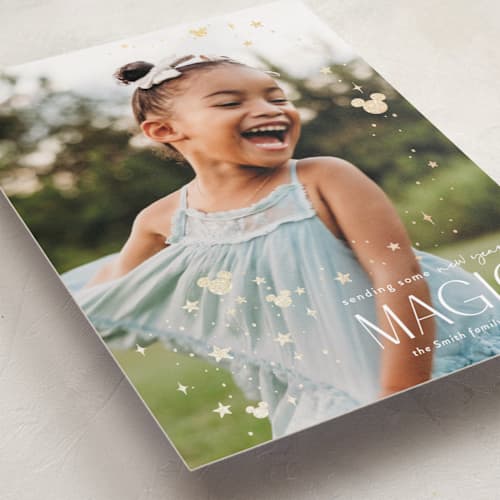 This is a mickey gloves foil pressed holiday cards with foil pressed by Danie Romrell called disney's mickey holiday magic printing on recycled smooth signature in standard