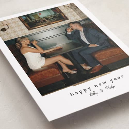 This is a cinder foil pressed holiday cards with foil pressed by Melanie Kosuge called moderne printing on recycled smooth signature in standard