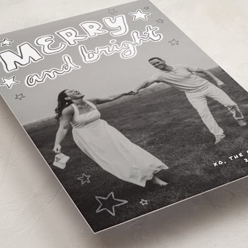 This is a snow foil pressed holiday cards with foil pressed by Everett Paper Goods called casual written printing on recycled smooth signature in standard